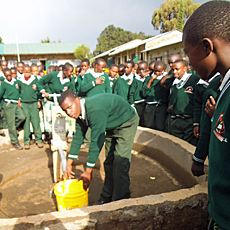 Boys at Newly Repaired Pump